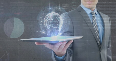 Image of globe, statistics and financial data processing over businessman holding tablet