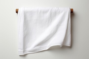 A single white towel placed against a plain white background
