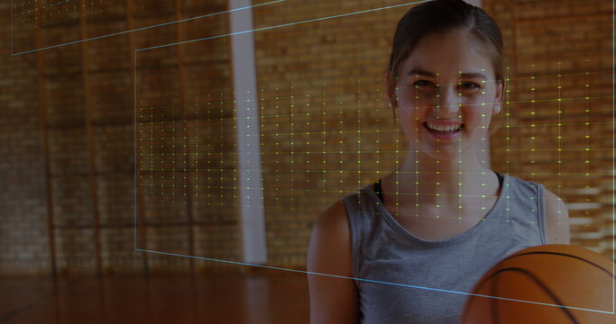 Image of neon heart rate over happy caucasian woman with basketball - Powered by Adobe