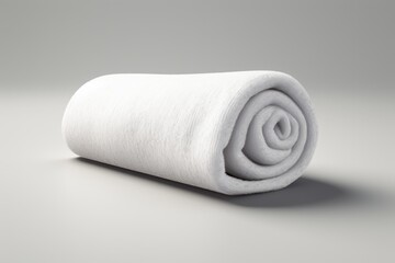 A white background showcases a soft towel made of terry cloth rolled up neatly - obrazy, fototapety, plakaty