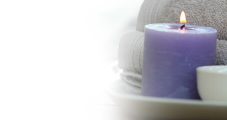 Image of white background over towels and candle