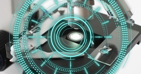 Image of scope scanning over laboratory microscope on white background