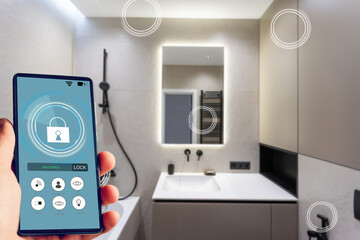 Fototapeta na wymiar All the house in a phone. Close up of young woman user hands controlling electronic objects in modern luxury studio apartment via smart home interface on cell screen. Internet of things ios technology
