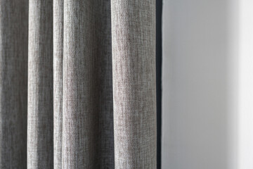 Fototapeta premium Gray velvet textile curtains decoration in home. Close up