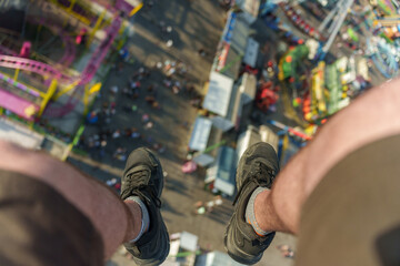 First person view of a skydiver flying above a fair