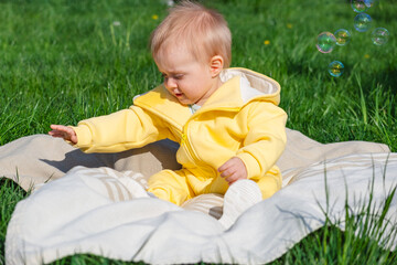 Curious baby exploring the world around him on a sunny day