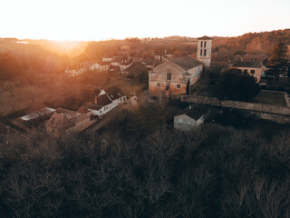 Molières seen from a drone at sunrise, with warm colors, in the Dordogne.