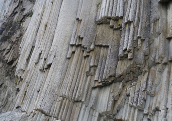 texture of porous stones on the beach, nature, natural phenomena, grey stones, columnar stones, lava rocks                    