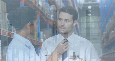 Image of statistics and financial data processing over man and woman working in warehouse