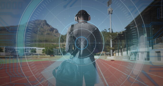 Image of digital data processing over disabled male athlete walking on racing track - Powered by Adobe