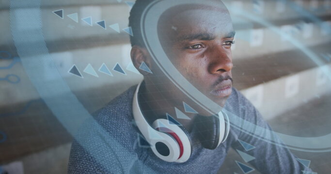 Image of digital data processing over male athlete drinking water in stands of sports stadium