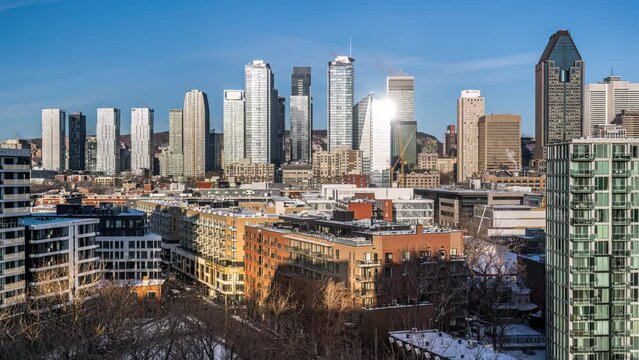 Daylight time lapse view of downtown Montreal from Griffintown in winter morning