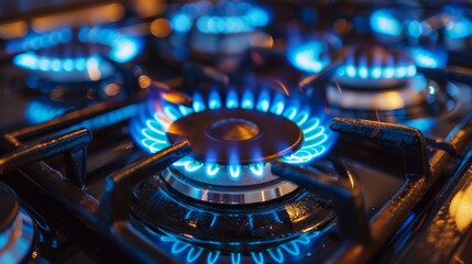  a gas stove with blue flames - obrazy, fototapety, plakaty