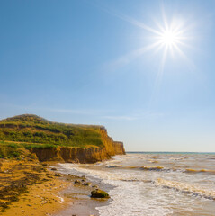 Fototapeta na wymiar sea bay with rocky coast at the summer sunny day