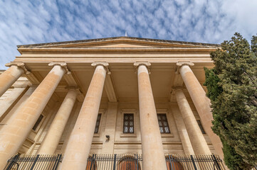 Courts of Justice building in the historic center of Valletta, Malta, under a dramatic sky