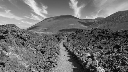 black and white image of volcanic landscape with volcanic rocks, la palma, canary islands - obrazy, fototapety, plakaty