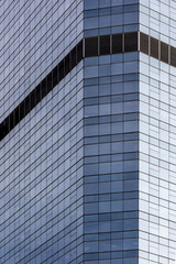 Fototapeta na wymiar Modern office building exterior. Abstract glass windows