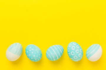 Blue easter eggs on color background, top view