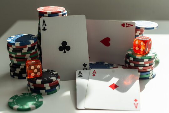 two aces in the hands of a close up. An concept Image of a poker table. two aces, two playing cards and poker chips on the green casino table on a black background. success in gambling. soft focus - Powered by Adobe