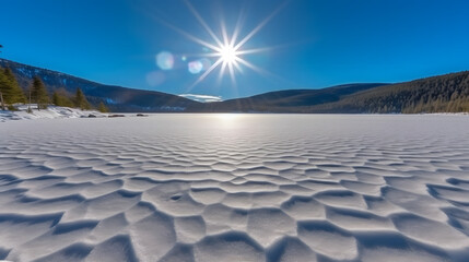 Fototapeta na wymiar Bright morning after fresh snow over frozen lake 