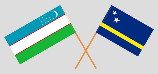 Crossed flags of Uzbekistan and Country of Curacao. Official colors. Correct proportion