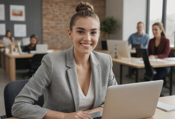Confident businesswoman working on a laptop in a corporate office. Professional and focused atmosphere.