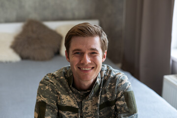 Portrait of caucasian soldier in uniform smiling - Powered by Adobe