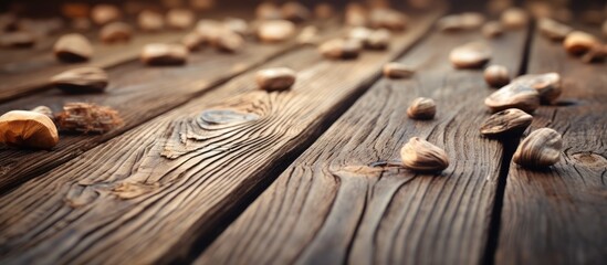 An upclose shot of a hardwood table adorned with natural rocks, displaying the beautiful wood grain pattern and wood stain finish - obrazy, fototapety, plakaty