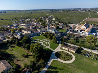 Aerial view on green vineyards, wine domain or chateau in Haut-Medoc red wine making region,...
