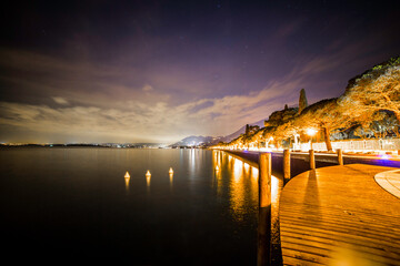 Salo on lake Garda pier illuminated at night