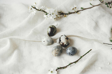 Easter flat lay. Stylish easter eggs and cherry blossom on rustic linen cloth. Happy Easter!...