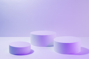 Set of three round pedestal mockup for cosmetic products in  pink violet vr neon light. Abstract scene for presentation skin care products, gifts, advertising, sale, design, goods in vapor wave style.