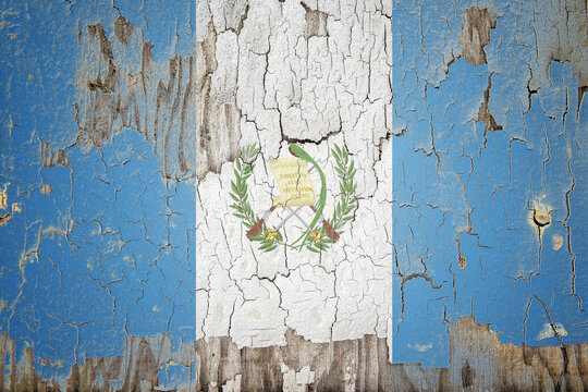 Guatemala flag painted on the cracked wall