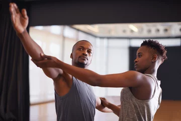 Foto auf Acrylglas Tanzschule Art, creative or dance with student and teacher in class together for theater performance training. Fitness, learning and school with black man instructor teaching dancer in studio for production