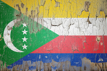 Comoros flag painted on the cracked wall