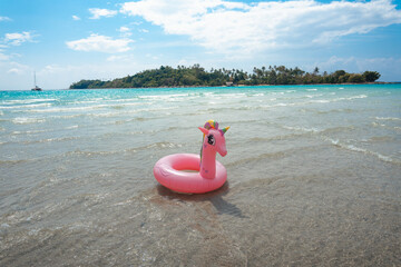Pink rubber ring and beach scenery on the island