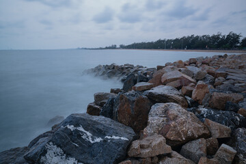 Rock breakwater in the sea in the morning
