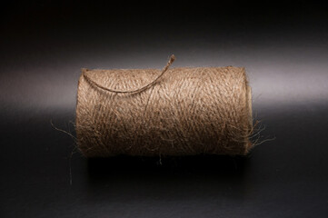 reel of hemp cord front view on black back ground