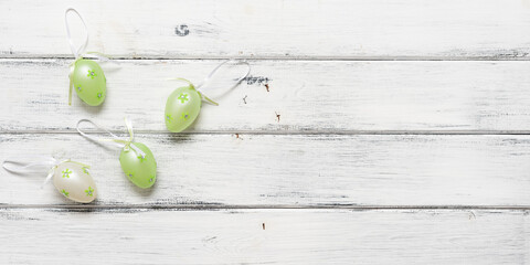 Easter decorative eggs on an old wooden white background. Top view, flat lay, banner. - 757104727