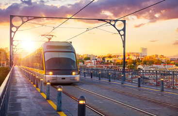 Porto, Portugal. Evening sunset panoramic view at the public transport tram on Ponte de Dom Luis...