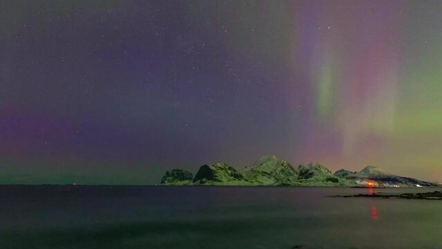 Timelapse of the northern lights over Haukland beach