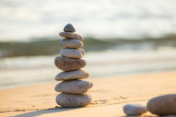 Pebble tower balance harmony stones over the beach