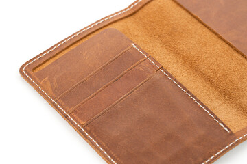 Handmade products made of genuine brown leather. Leather passport cover, leather wallet. Leather goods for men. Leather passport cover isolated on white background. Craft, handmade.