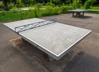 Stationary tennis tables in a city park