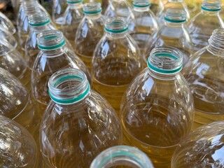 A lot of plastic bottles without cap filled with groundwater.