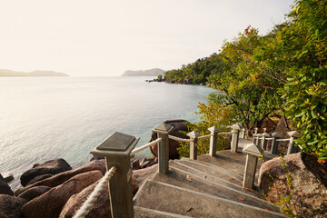 Stairs leading to idyllic beach. Coastal landscape on coast of Seychelles. - 757143343