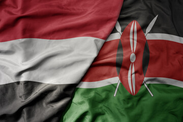 big waving national colorful flag of kenya and national flag of yemen .