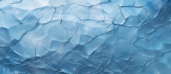 Obraz premium A closeup of a fragment of electric blue ice from a polar ice cap, a solid form of water, created by freezing liquid aqua, eventually melting into snow