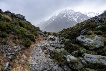 View of rainy hike to Kea Point lookout, Mount Cook National Park, New Zealand. Dramatic landscape,...