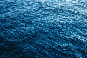 a blue water surface with small ripples - obrazy, fototapety, plakaty